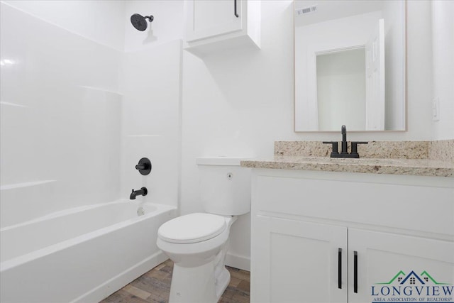 full bathroom with vanity, hardwood / wood-style floors, toilet, and bathtub / shower combination