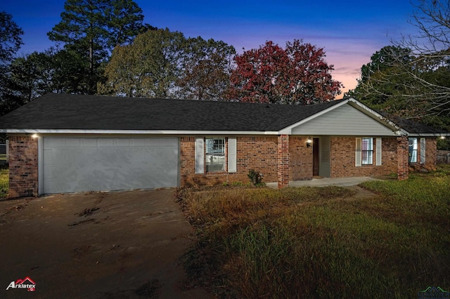 single story home featuring a garage