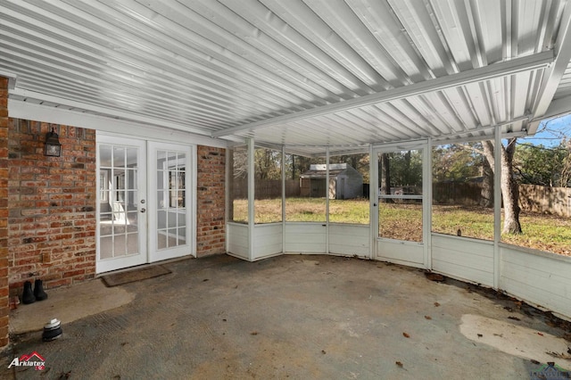 unfurnished sunroom featuring french doors