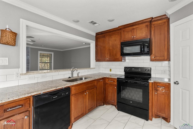 kitchen with sink, light stone counters, backsplash, crown molding, and black appliances