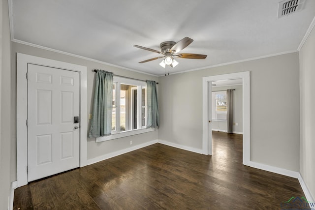 foyer entrance featuring ornamental molding, dark hardwood / wood-style floors, and ceiling fan