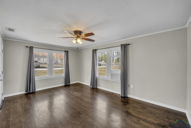 spare room with ornamental molding, dark hardwood / wood-style floors, and ceiling fan