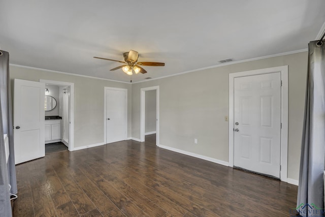 empty room with crown molding, ceiling fan, and dark hardwood / wood-style flooring