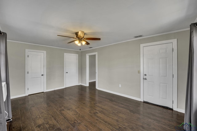 empty room featuring crown molding, ceiling fan, and dark hardwood / wood-style floors