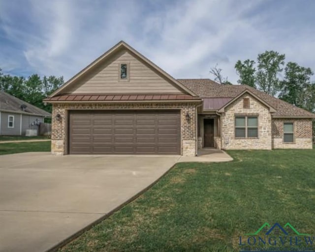 489 N Sanders St, White Oak, TX 75693 - single story home with brick siding, driveway, an attached garage, and a front yard