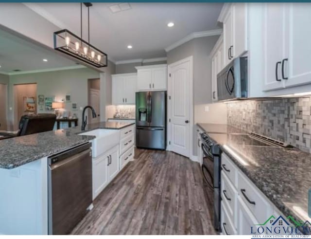 kitchen with stainless steel appliances, dark wood-type flooring, and white cabinets