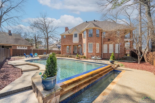 view of pool with a patio area, a fenced in pool, and a fenced backyard