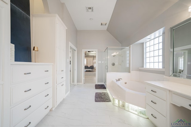 bathroom featuring visible vents, a shower stall, vaulted ceiling, a garden tub, and marble finish floor