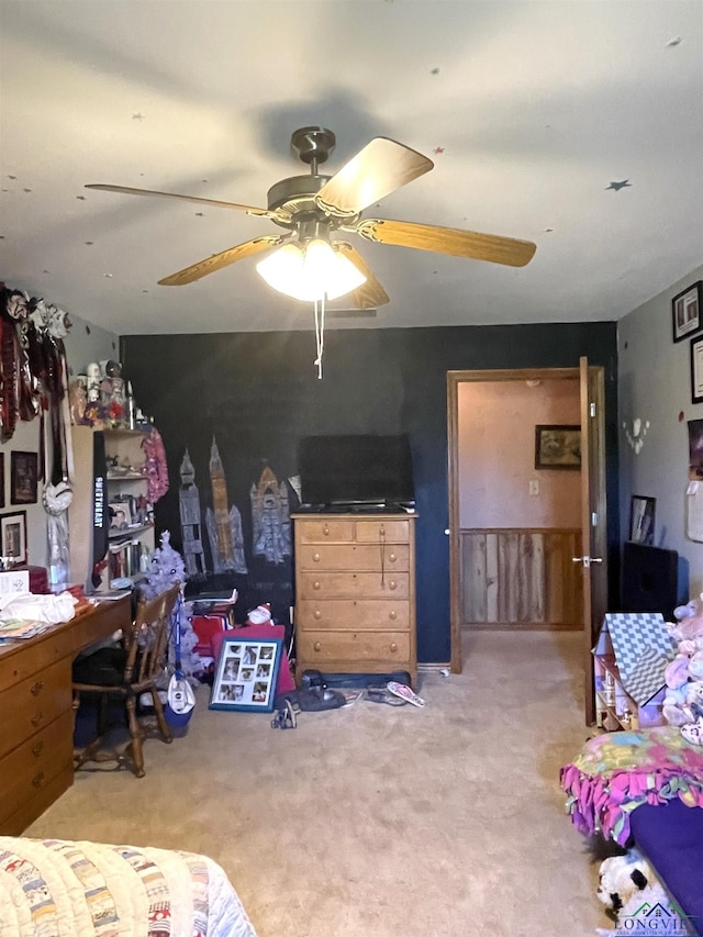 bedroom featuring ceiling fan and light carpet