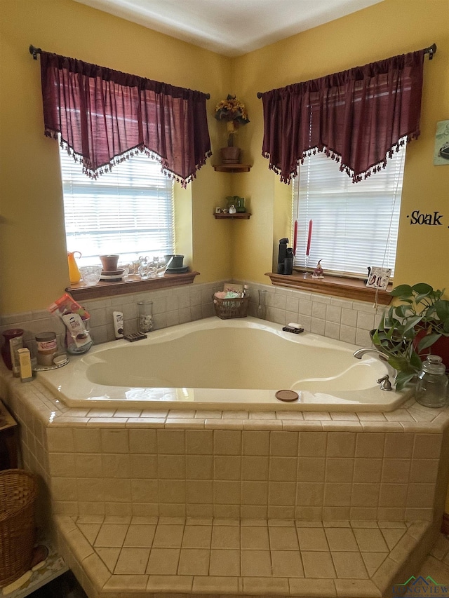 bathroom featuring tiled tub