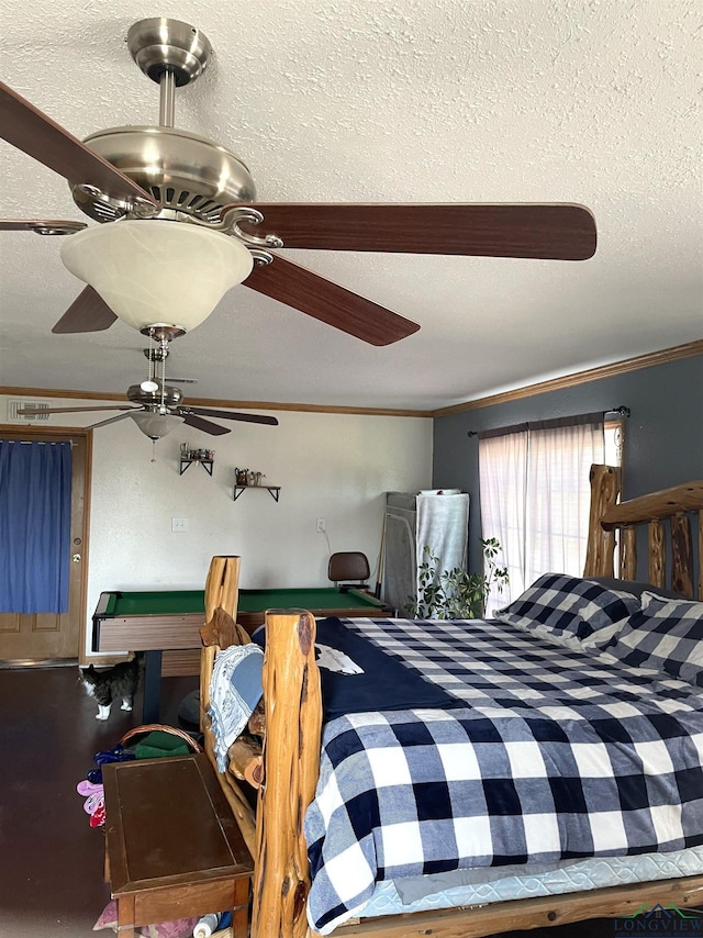 bedroom with crown molding, ceiling fan, and pool table