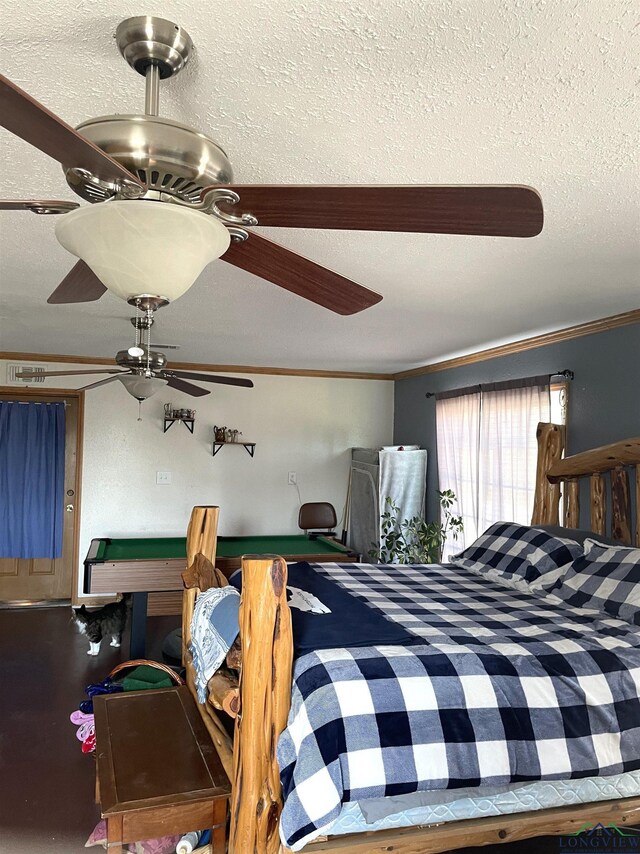 bedroom with crown molding, ceiling fan, and pool table