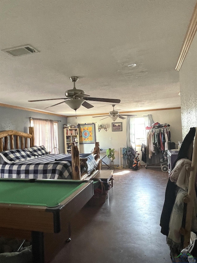 rec room with ceiling fan, crown molding, a textured ceiling, and pool table