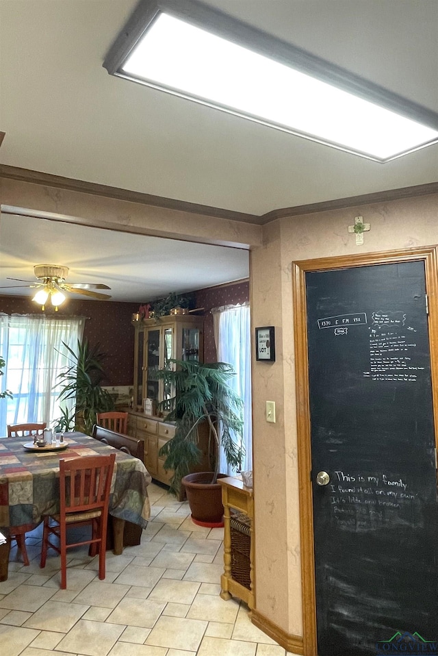 dining space featuring ceiling fan