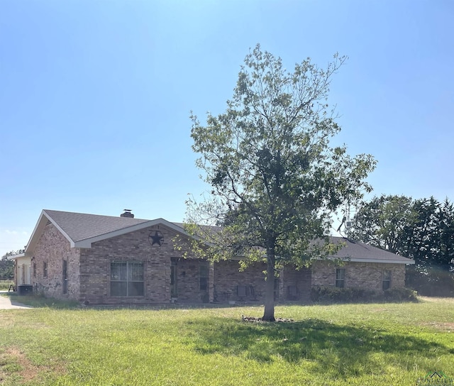 view of home's exterior featuring a lawn