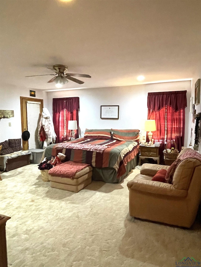 carpeted bedroom featuring ceiling fan