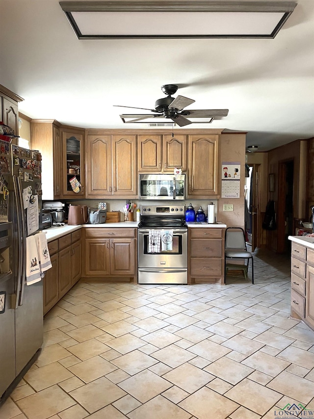 kitchen featuring ceiling fan and appliances with stainless steel finishes