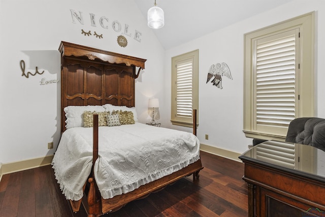 bedroom with dark hardwood / wood-style flooring and lofted ceiling