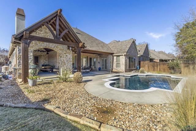 view of pool with a patio area and ceiling fan