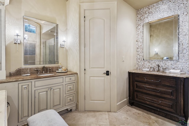 bathroom with decorative backsplash and vanity