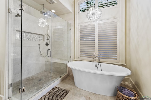 bathroom with plus walk in shower and tile patterned flooring