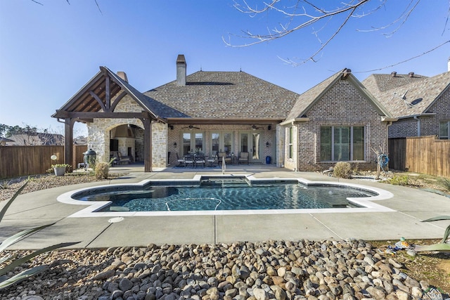 view of swimming pool featuring a patio area and ceiling fan