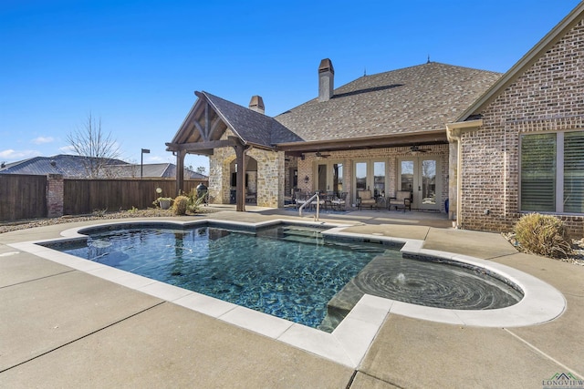 view of swimming pool featuring a patio and ceiling fan