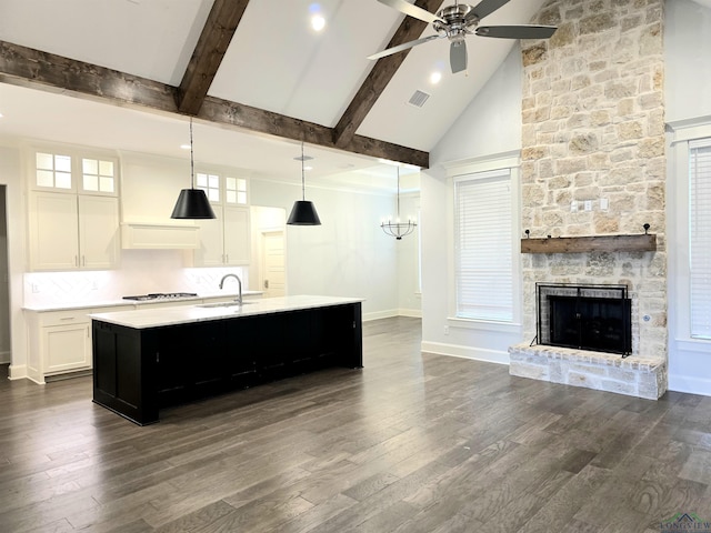 9173 Cave Branch Cv, Tyler, TX 75703 - kitchen with ceiling fan, a sink, light countertops, and open floor plan