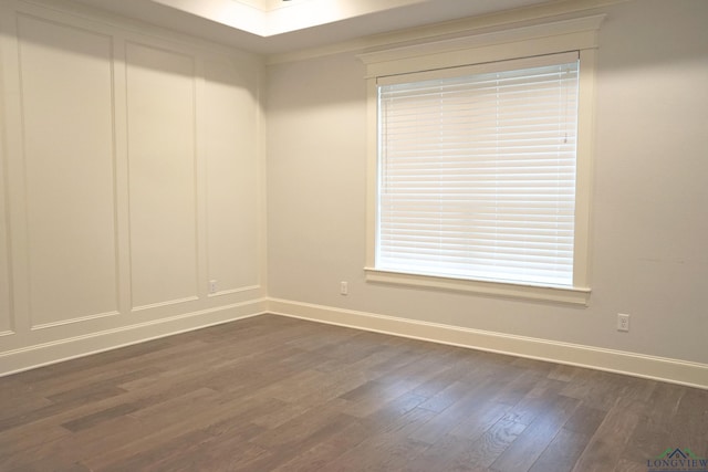 9173 Cave Branch Cv, Tyler, TX 75703 - empty room featuring baseboards and dark wood-style floors