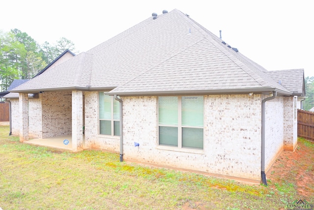 9173 Cave Branch Cv, Tyler, TX 75703 - rear view of property with a patio area, fence, brick siding, and a yard
