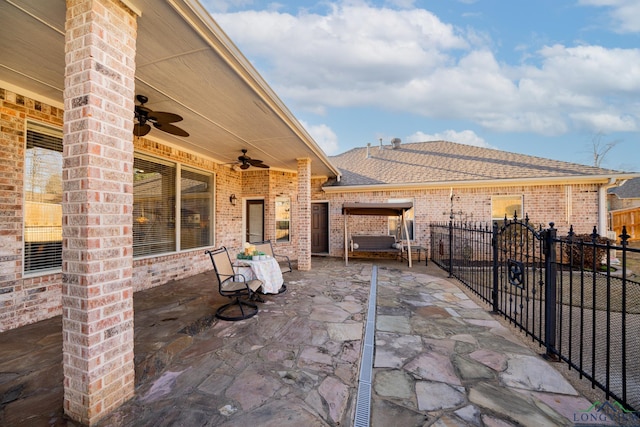 view of patio / terrace with fence private yard and a ceiling fan