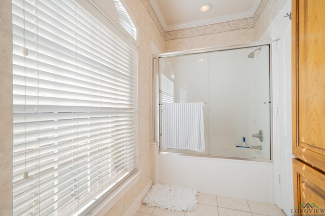 bathroom with ornamental molding, tile patterned flooring, and bath / shower combo with glass door