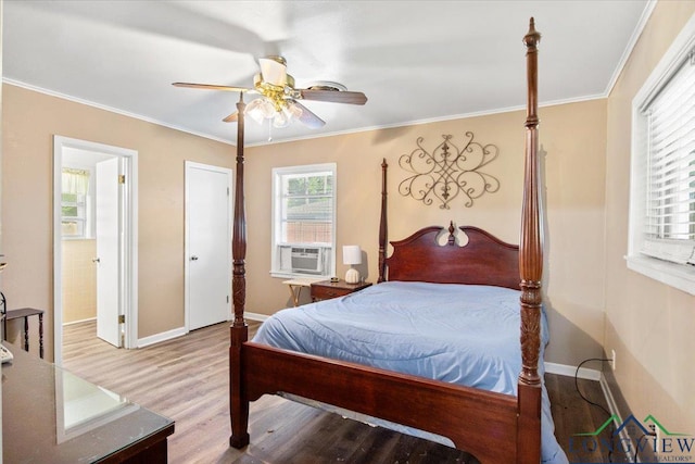 bedroom with wood finished floors, baseboards, crown molding, a ceiling fan, and cooling unit