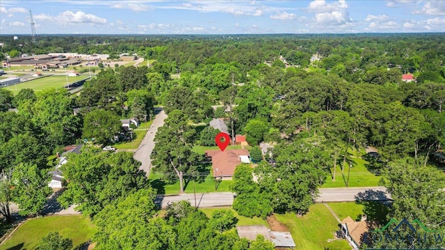 aerial overview of property's location featuring a forest