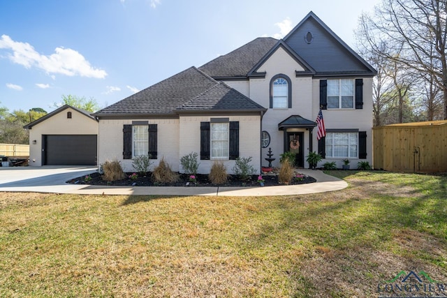 view of front of property with a front lawn and a garage