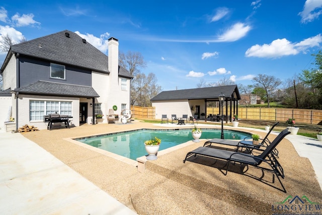 view of pool featuring a fenced backyard, a fenced in pool, and a patio