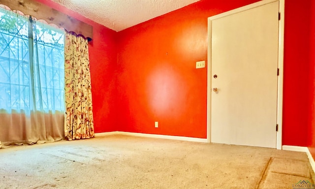 empty room with a textured ceiling