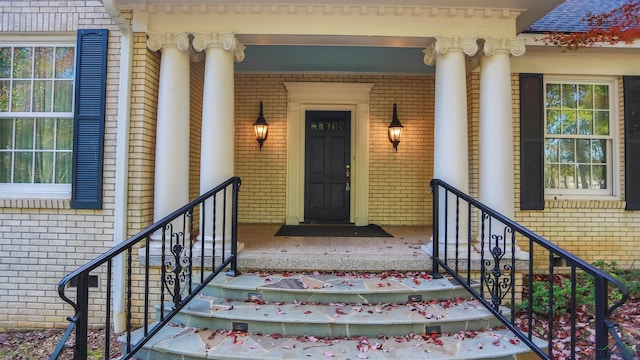 view of exterior entry with covered porch