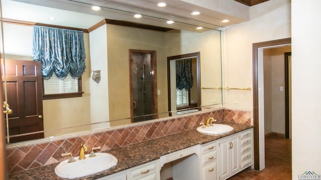 bathroom featuring decorative backsplash and vanity