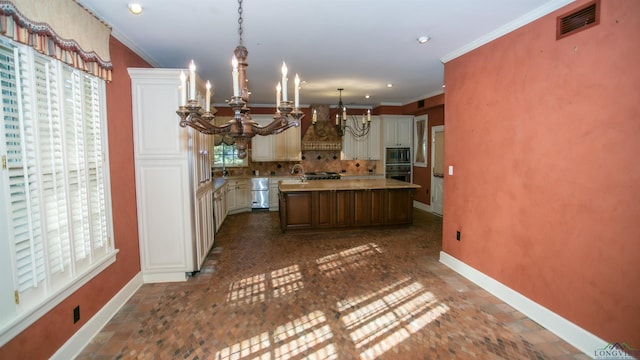 kitchen featuring custom exhaust hood, built in microwave, black oven, a notable chandelier, and a kitchen island