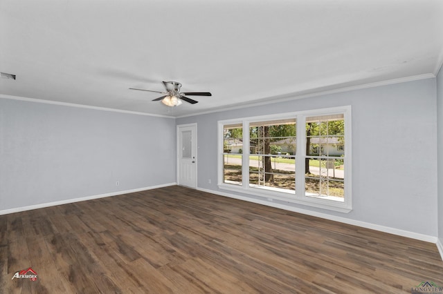 empty room featuring ceiling fan, dark wood-type flooring, and ornamental molding