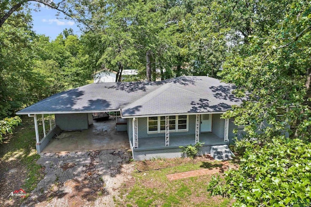 view of front facade with a carport and covered porch