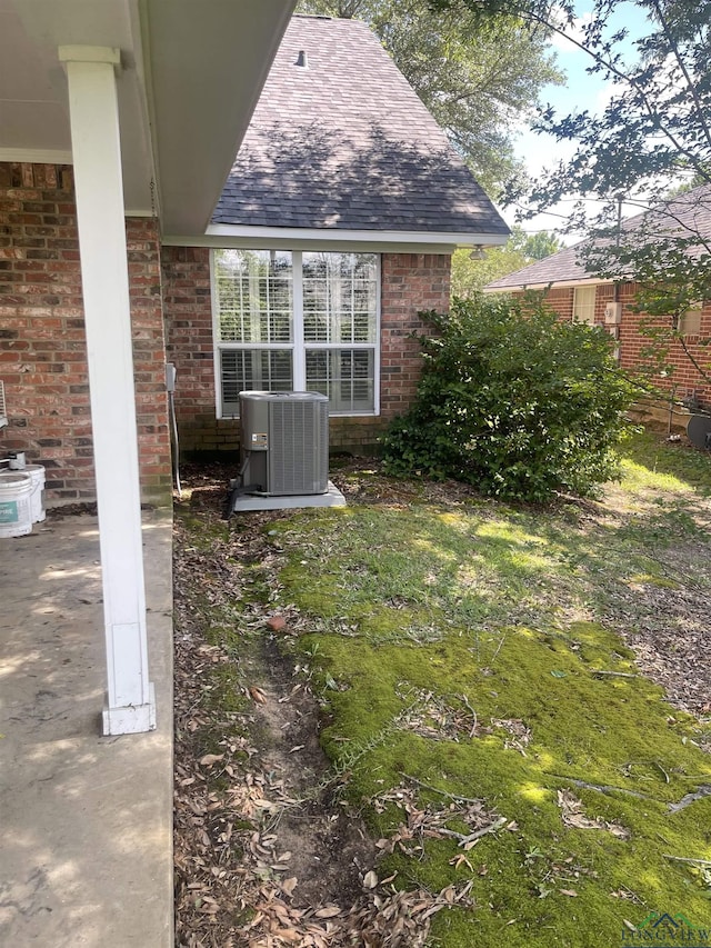 1404 Stonebriar Dr, Carthage, TX 75633 - view of yard with central AC unit