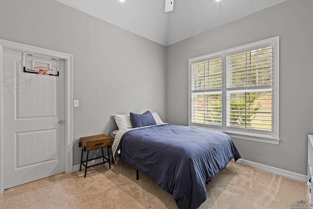 bedroom featuring light colored carpet, ceiling fan, and lofted ceiling