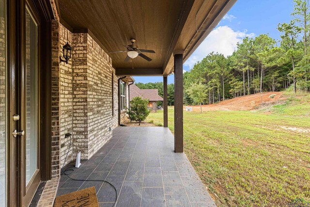 view of patio featuring ceiling fan