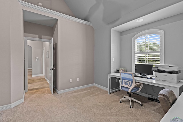 carpeted office with lofted ceiling