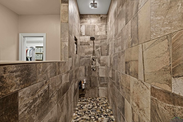 bathroom with a tile shower