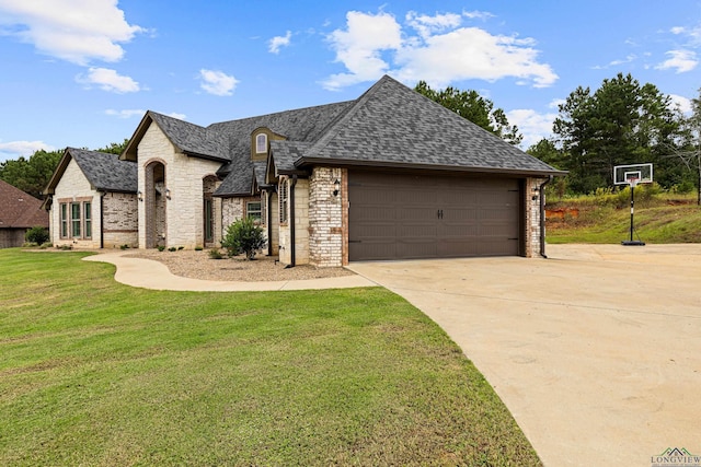 view of front of home with a front lawn and a garage