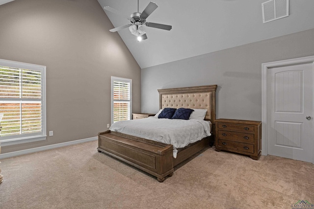 bedroom featuring ceiling fan, light carpet, and high vaulted ceiling