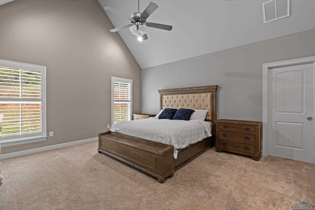 bedroom featuring ceiling fan, light carpet, and high vaulted ceiling